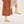 Close up of Bogota cream vegan boots for women styled with neutral outfit highlighting chunky sole and minimalist design