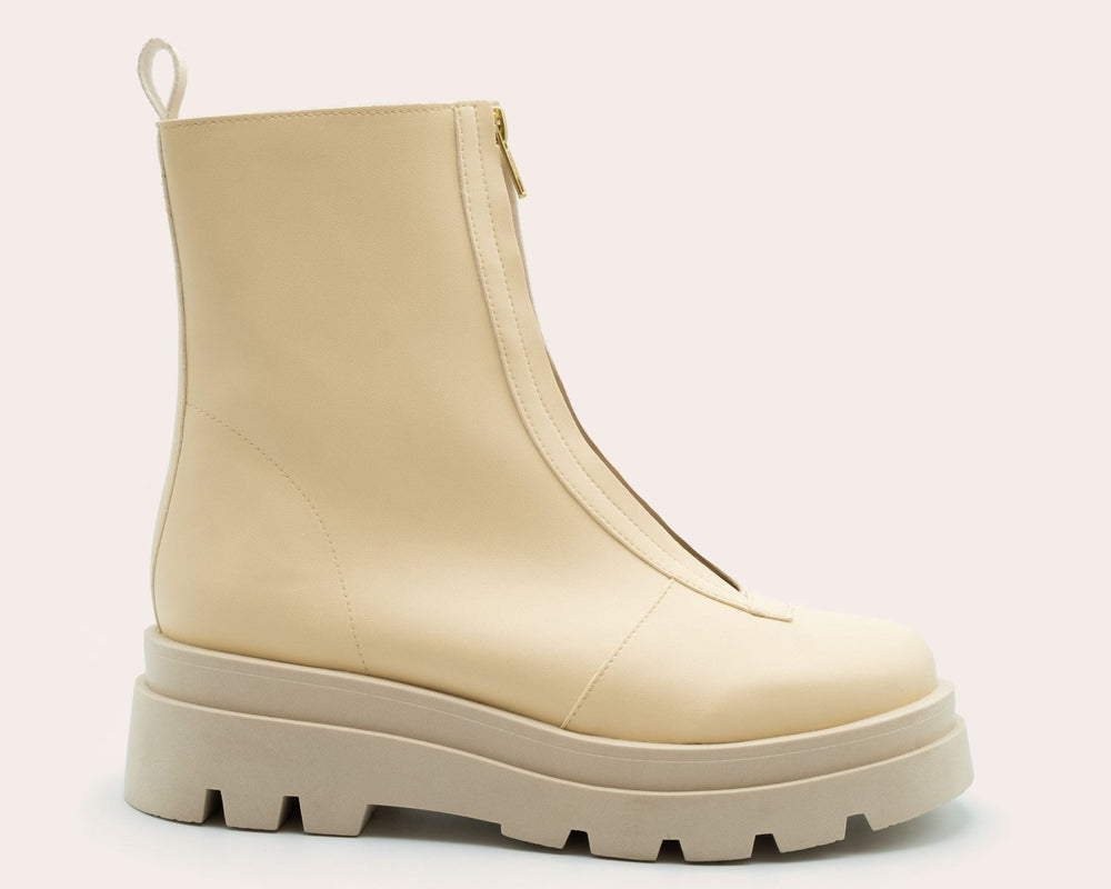Close up side view of Bogota cream vegan boots for women highlighting chunky sole and minimalist design