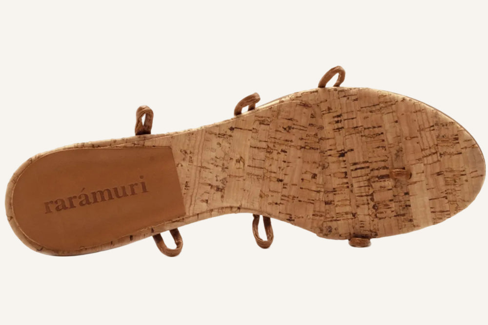 Bottom view of Camila Plus vegan lace up heels showing cork sole detail on neutral background