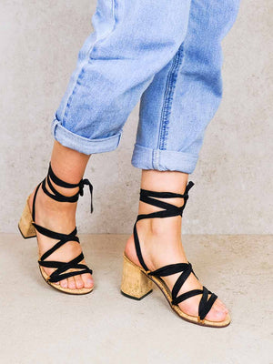Woman wearing Camila vegan lace up heels with black ribbons styled with rolled up jeans