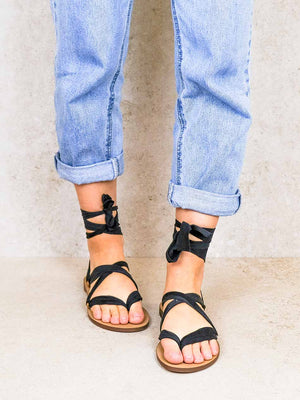 Cancun black vegan lace-up ribbon sandals on-foot front view with ankle ties