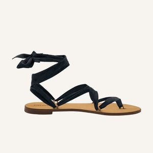 Cancun vegan black lace-up ribbon travel sandals side view with flat sole and ankle ties