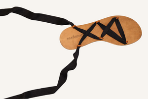 Capri black vegan lace-up ribbon travel sandals flat lay with extended ribbons