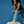Woman wearing vegan platform boots styled with denim outfit with one foot elevated highlighting chunky sole and design