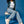 Woman wearing vegan platform boots styled with denim outfit sitting in studio highlighting chunky sole and fit
