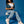 Woman wearing vegan platform boots styled with denim outfit sitting in studio, casual sustainable fashion look