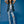 Woman wearing vegan platform boots styled with denim outfit in studio smiling and posing, casual sustainable fashion