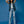Woman wearing vegan platform shoes styled with denim outfit in studio, casual sustainable fashion look